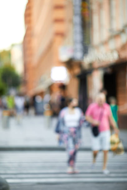 istock blurred people crossing street 1269845939