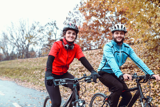 istock Couple Spending A Rainy Day Cycling In The Park 1269846989