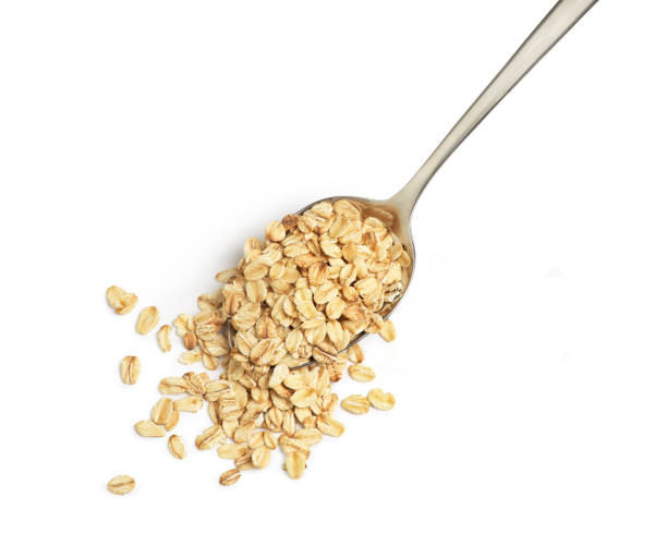istock oatmeal in a spoon on a white background 1269847242