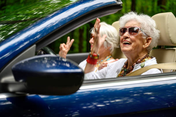 Senior best friend women on a road trip stock photo