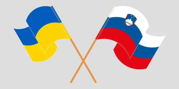 Vector illustration of Crossed and waving flags of Ukraine and Slovenia