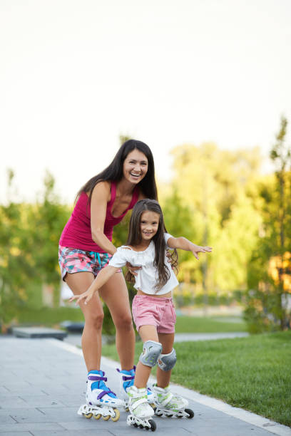 istock mother and her little daughter rollerskating 1269851453