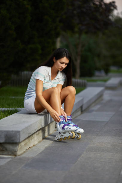 istock happy woman is wearing roller skates 1269851883