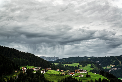 Storm clouds over the little village of Gardena Valley, Alto Adige, Italy
