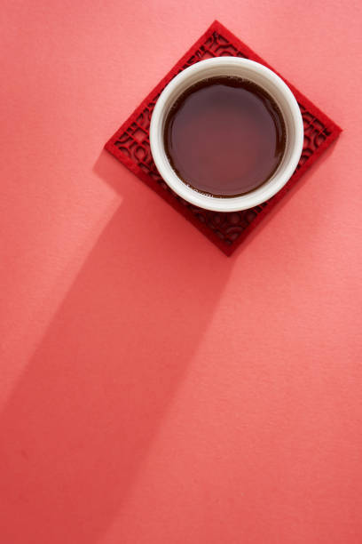green tea and tea bag on table, close up