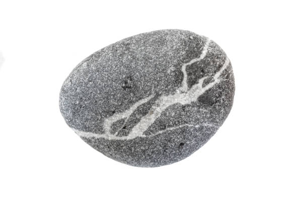 istock Isolated pebble stone cut out on white background in extreme resolution and macro detail. 1269855253