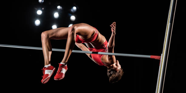 istock High jumper in mid-air above the bar 1269858258