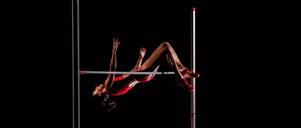 istock High jumper in mid-air while jumping over the bar 1269858261