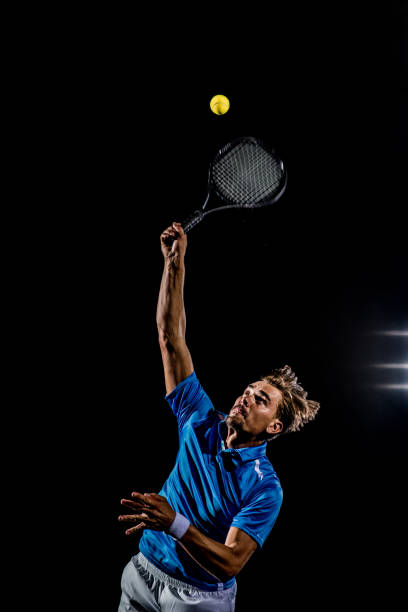 istock Caucasian tennis player making a serve 1269858296