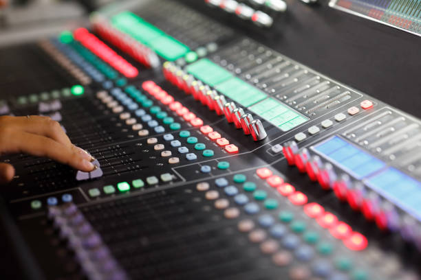 istock digital sound mixing console with hand on faders 1269859646
