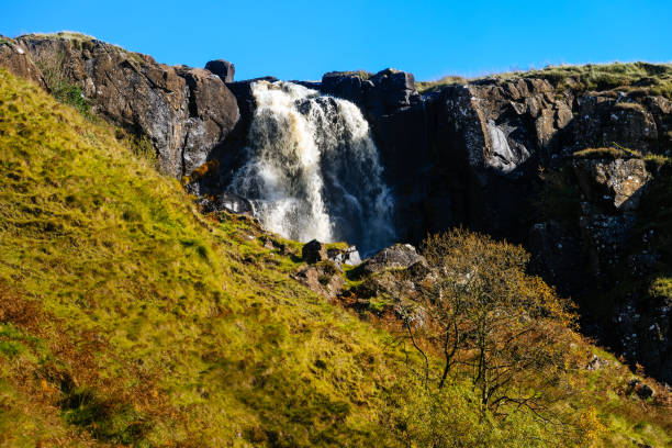 Beautiful waterfall and stream in the valley of Glenariff Forest Park Beautiful waterfall and stream in the valley of Glenariff Forest Park in autumn colours, Count Antrim, Northern Ireland glenariff photos stock pictures, royalty-free photos & images