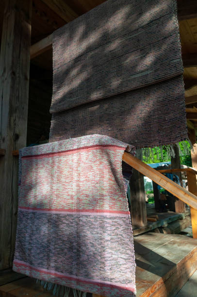 istock fabric rugs hang on wooden railings 1269861458