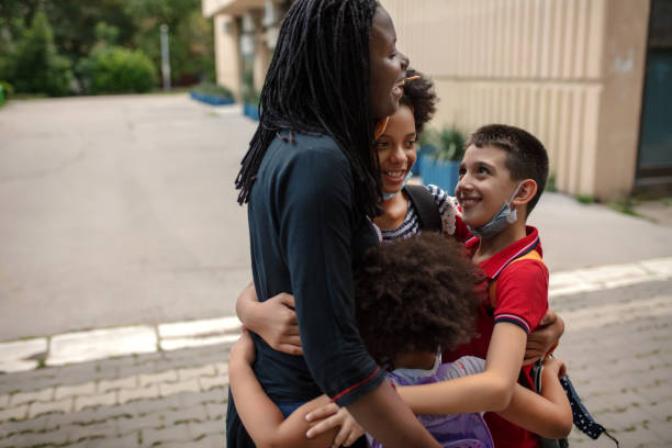 istock Mother taking kids to school 1269861822