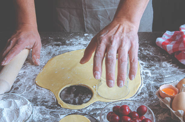 istock A man prepares a strudel with cherries in the home kitchen 1269861921