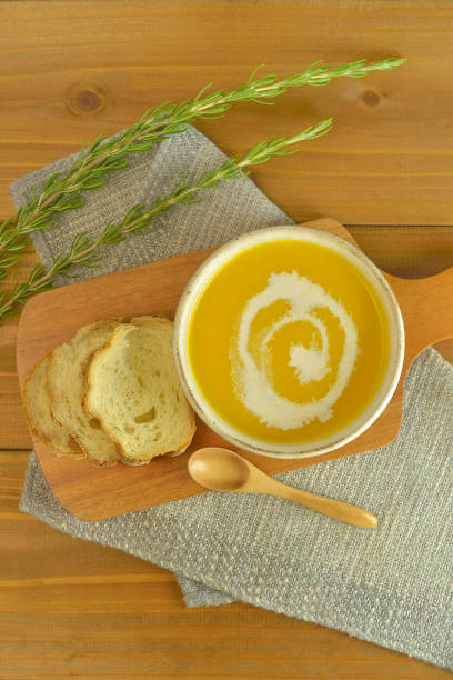istock Pumpkin Soup & Pieces of Bread on the Table 1269862146