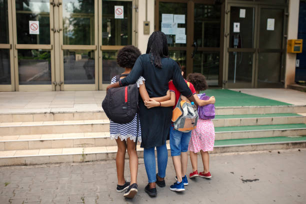 istock Mother taking kids to school 1269862801