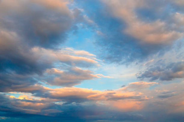 istock Bright cumulus clouds against the blue sky. Sunset sky Natural background. 1269863987