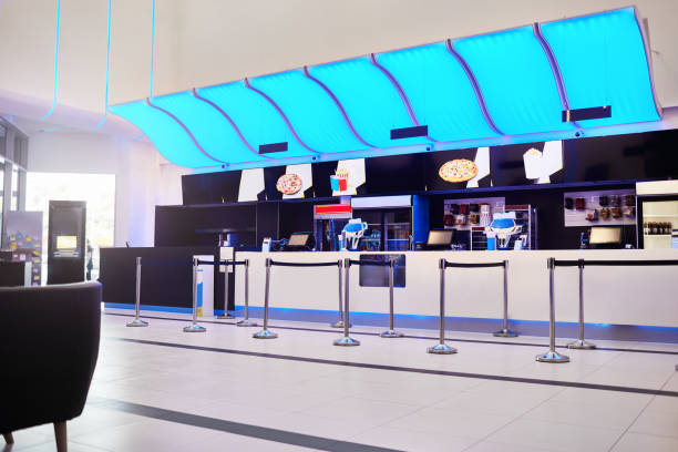 Shot of empty movie theater lobby with cashier desk ready for reopening after coronavirus pandemic.