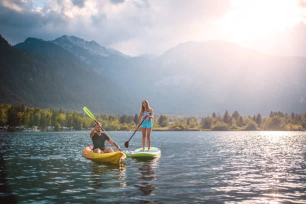 istock Mid Adult Couple Kayaking and Paddleboarding on Vacation 1269865183