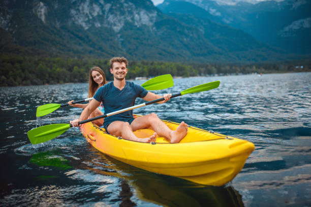 mid adult couple enjoying active summer vacation in slovenia - sport exercising men julian alps imagens e fotografias de stock