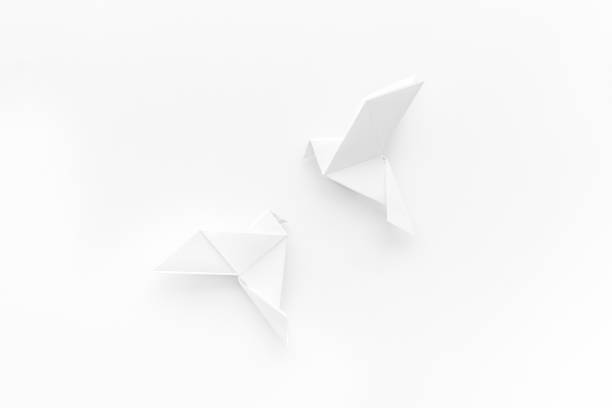 istock Origami birds are flying, overhead top view 1269865828