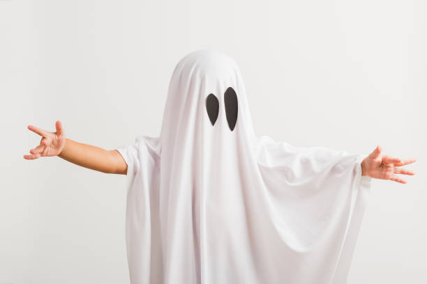 istock little cute child with white dressed costume halloween ghost scary 1269868418