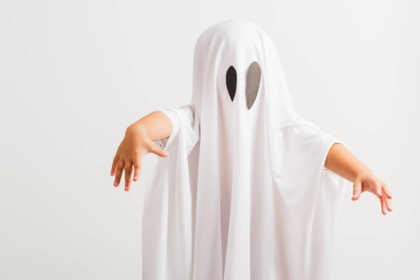istock little cute child with white dressed costume halloween ghost scary 1269868426