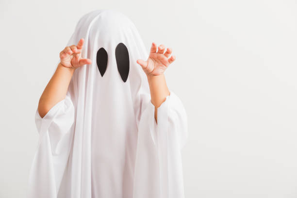 istock little cute child with white dressed costume halloween ghost scary 1269868432