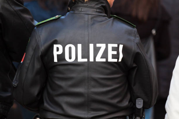 istock Walking police man in crowd in Essen 1269874899