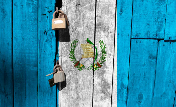 istock Guatemala flag is on texture. Template. Coronavirus pandemic. Countries may be closed. Locks. 1269875153