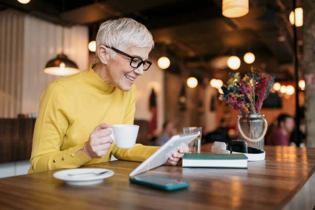 istock Happy Caucasian senior woman using a digital tablet computer 1269876672