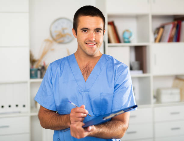 istock Positive latino doctor with folder of documents at office 1269878326