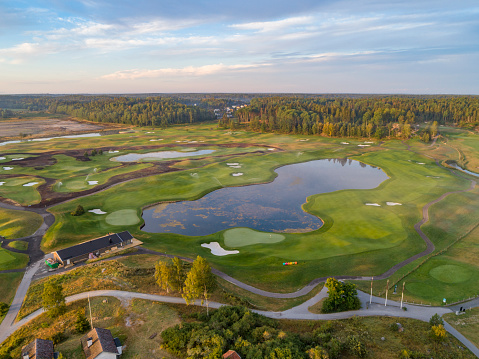 Aerial view over a Österåker Golf course in Åkersberga, Sweden. Morning fog at sunrise.