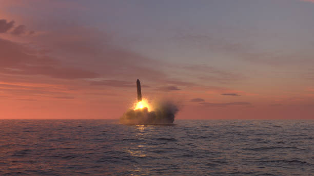 istock Ballistic missile launch from underwater at sunset 1269884020