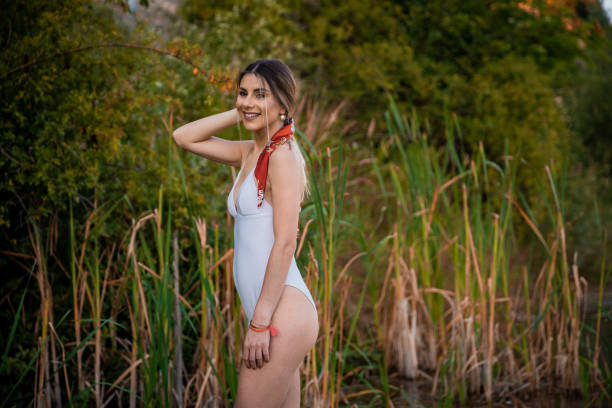 istock Happy woman having fun on lake 1269888807