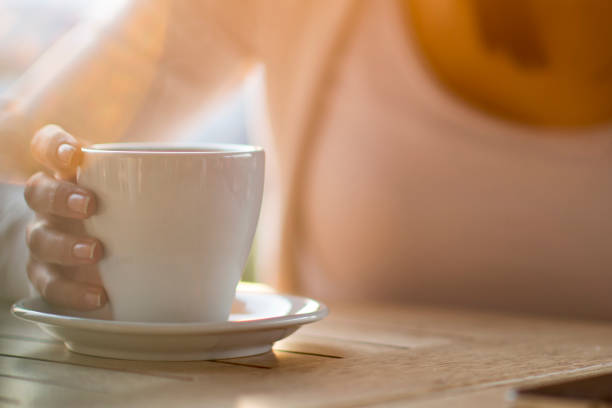 istock Young woman drinking a cup of coffee 1269890388