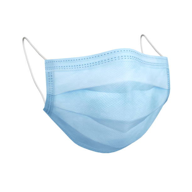 Blue protective face mask isolated over white Blue protective face mask isolated over white - COVID-19 pandemic concepts surgical mask stock pictures, royalty-free photos & images