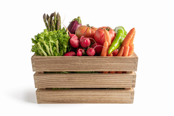 istock Wooden box with fresh vegetables, isolated from the white background 1269894415