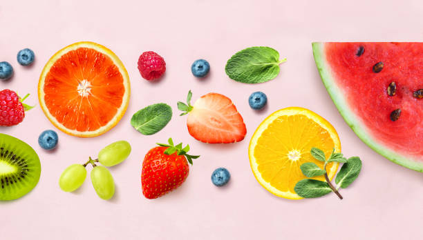 istock Fresh berry and fruit mix border frame banner on pink background. Flat lay. Fruit pattern 1269895790