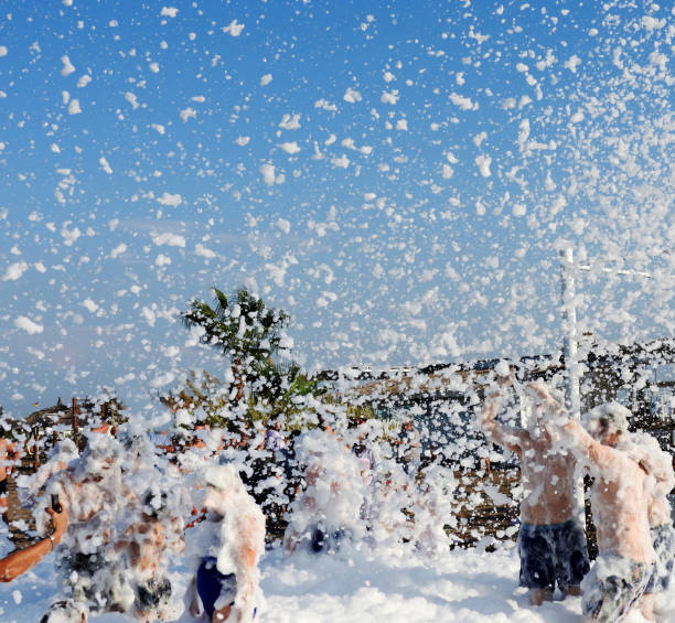 Antalya Turkey - October 21, 2019: On the beach music and people having fun with foam. An activity held in many hotels in the Mediterranean.