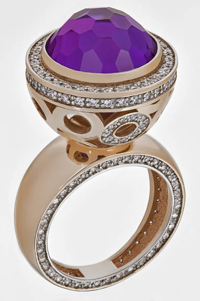 istock Golden ring with diamonds and precious gemstones 1269899237