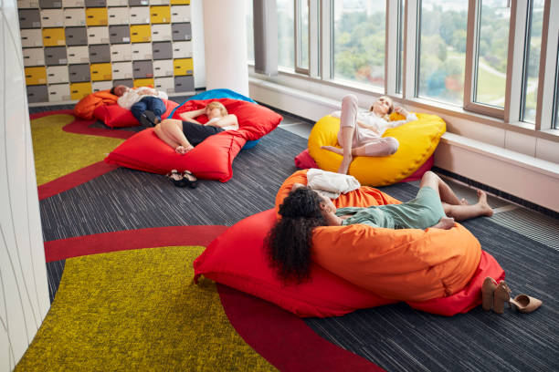 istock Diverse people working in modern office relaxing during lunch break 1269899901