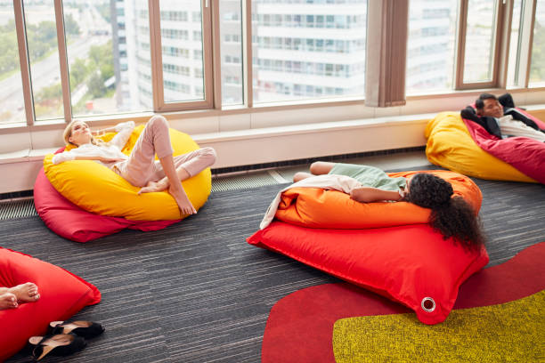 istock Diverse people working in modern office relaxing during lunch break 1269899932