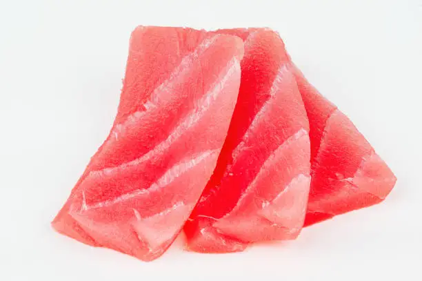 Raw tuna salt water fish slices isolated on white