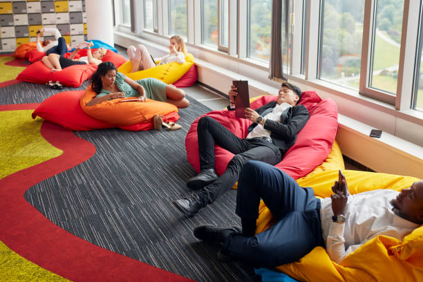 istock Diverse people working in modern office relaxing during lunch break 1269900015