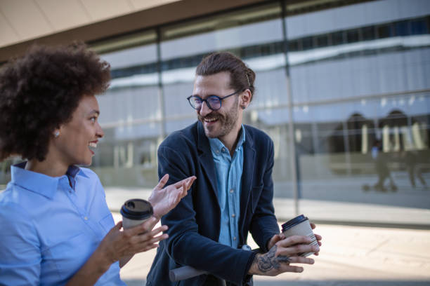 istock Two young business people on a coffee break 1269900575