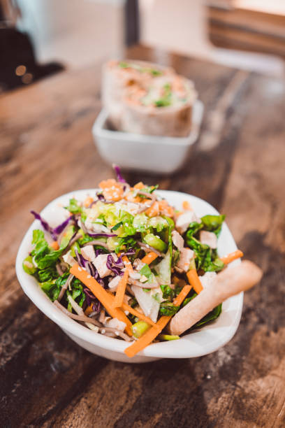 istock Fresh Salad In A Bowl On A Wooden Table 1269902122