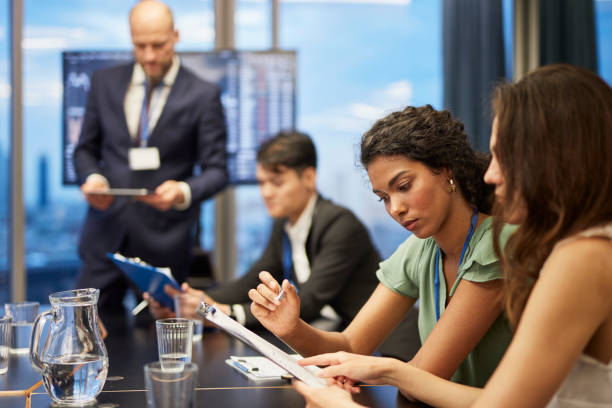 istock Business coach working with multi ethnic team. Friendly consultations 1269902516