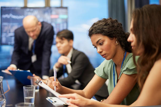 Business coach working with multi ethnic team. Friendly consultations