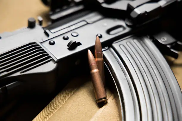 Closeup of a Kalashnikov MKK-104 assault rifle with bullets. 7.62x39 mm. Modern AK-47.